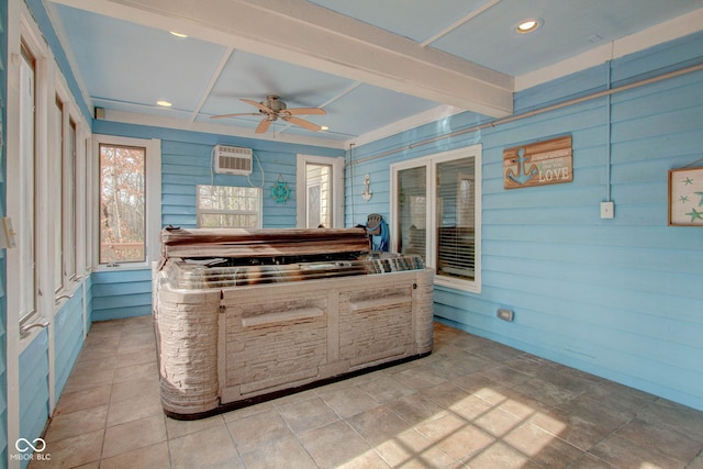 interior space with a wall mounted AC and ceiling fan