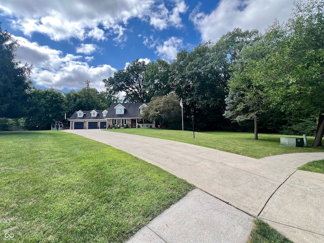 view of property's community with a lawn