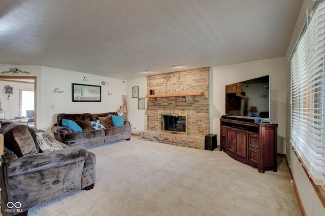 living room with a fireplace, a textured ceiling, and carpet