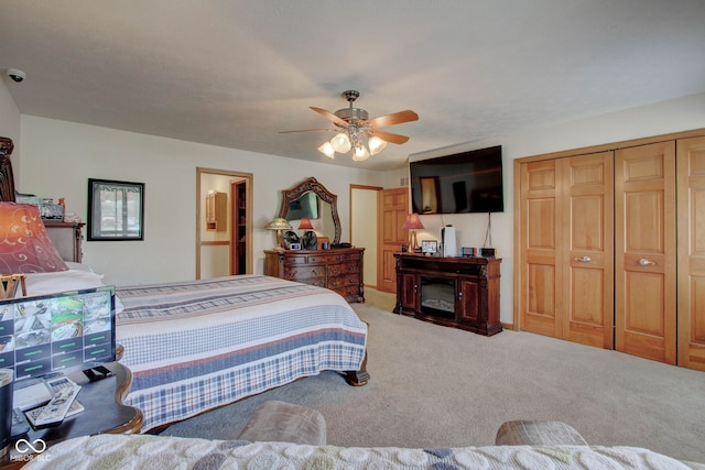 bedroom featuring a closet, ceiling fan, and carpet