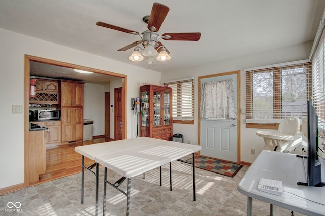 interior space featuring ceiling fan