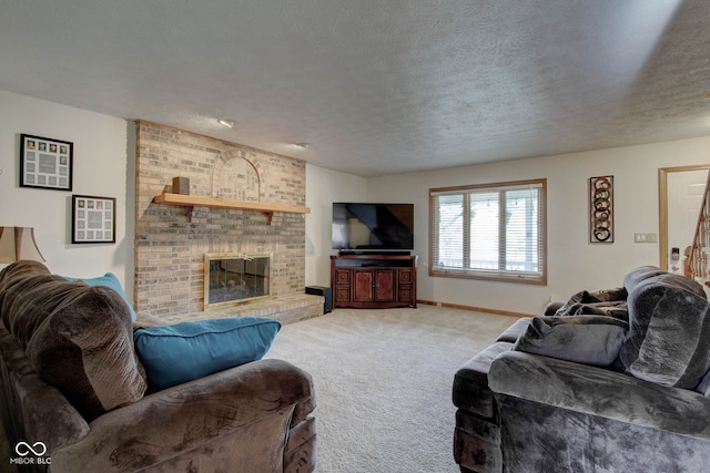 living room featuring a fireplace, a textured ceiling, and carpet flooring