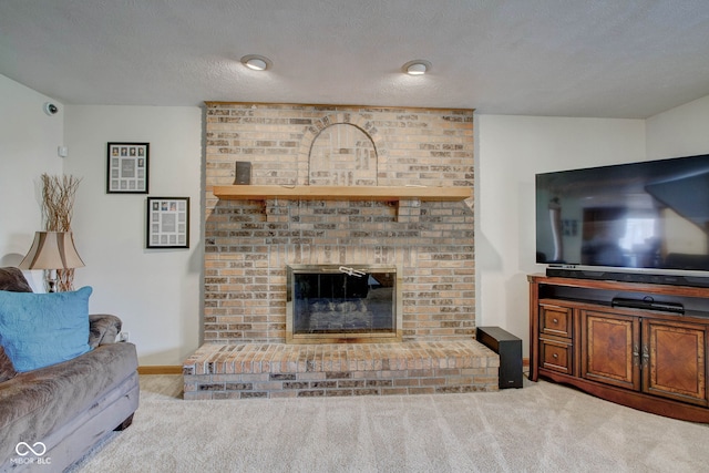 living room featuring a textured ceiling, carpet flooring, and a brick fireplace