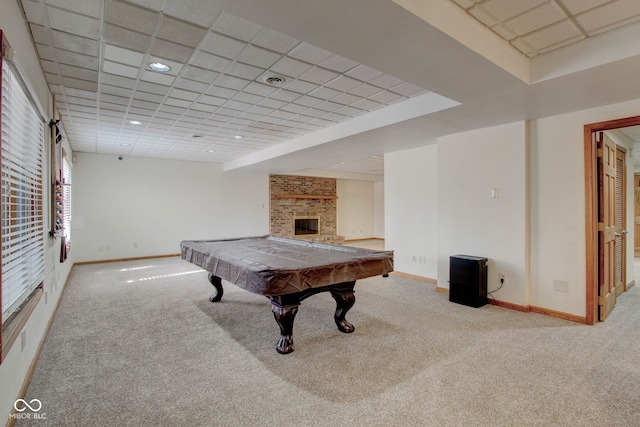 playroom featuring a paneled ceiling, billiards, a fireplace, and carpet