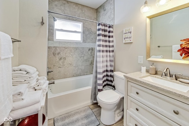 full bathroom with shower / bath combination with curtain, toilet, and vanity