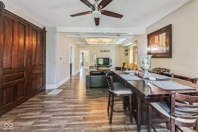 dining room featuring beamed ceiling, hardwood / wood-style flooring, coffered ceiling, a textured ceiling, and ceiling fan