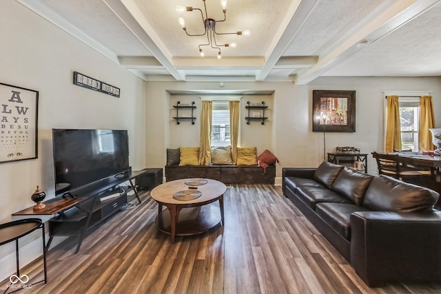 living room featuring a textured ceiling, beam ceiling, a chandelier, and hardwood / wood-style flooring