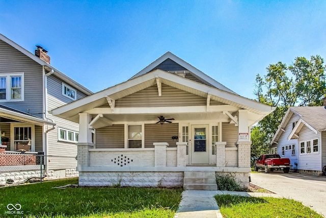 craftsman-style house featuring ceiling fan and a porch