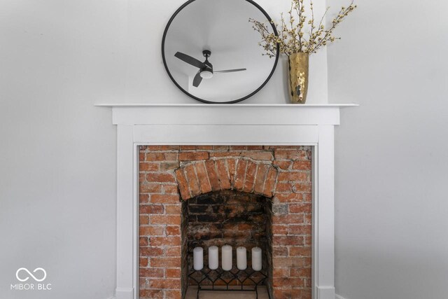 1046 Dawson St, Indianapolis, IN 46203 - interior details featuring a brick fireplace and a ceiling fan