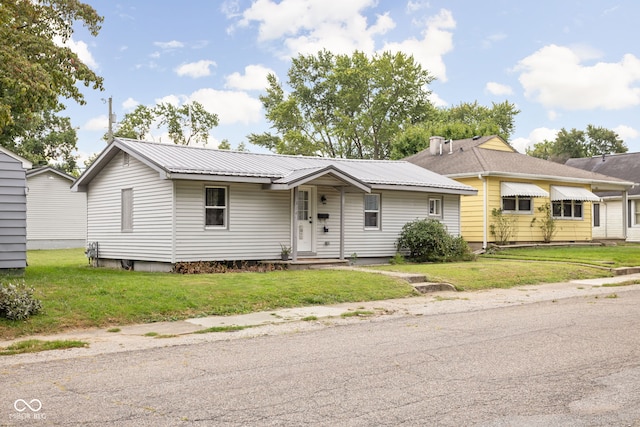 single story home with a front lawn