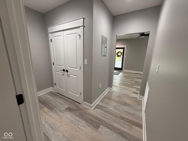 3380 N Pine Song Dr, Martinsville, IN 46151 - corridor with light wood-style floors, baseboards, and electric panel