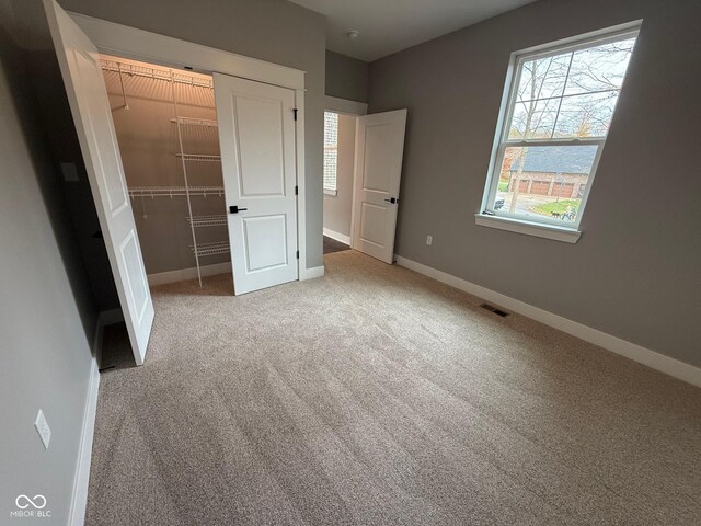 3380 N Pine Song Dr, Martinsville, IN 46151 - unfurnished bedroom with carpet floors, a closet, and a walk in closet