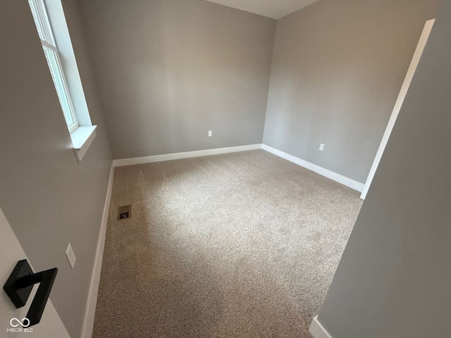 empty room featuring carpet flooring