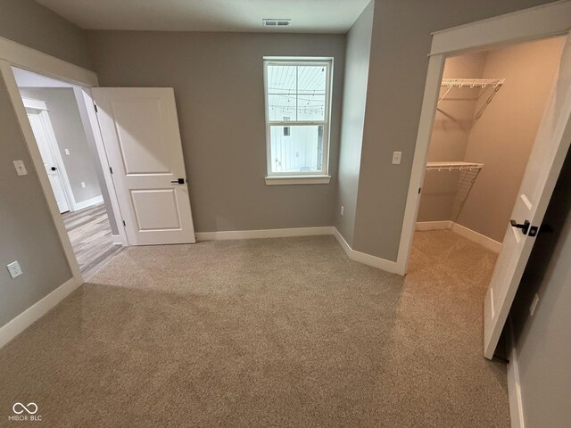 3380 N Pine Song Dr, Martinsville, IN 46151 - unfurnished bedroom featuring a spacious closet, carpet, baseboards, and a closet