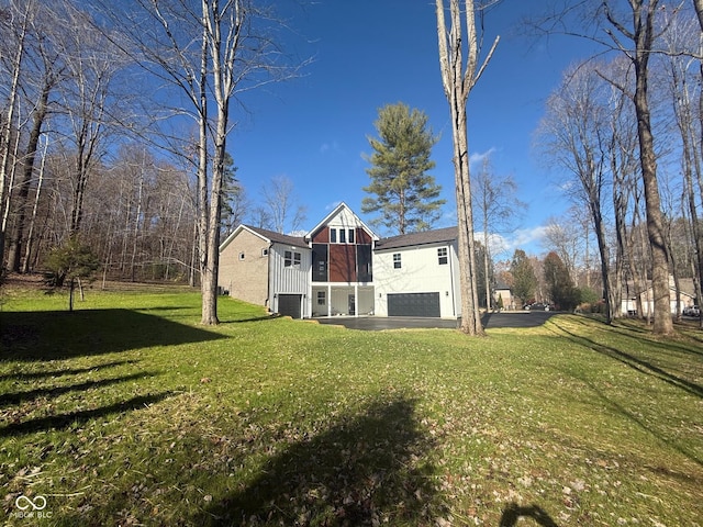 3380 N Pine Song Dr, Martinsville, IN 46151 - view of green lawn with a garage
