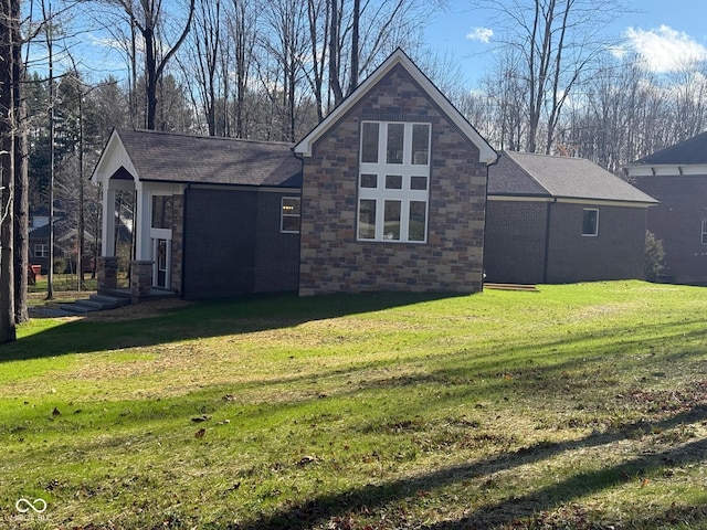 3380 N Pine Song Dr, Martinsville, IN 46151 - view of property exterior featuring a lawn, stone siding, and roof with shingles