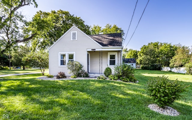 bungalow-style house with a front yard