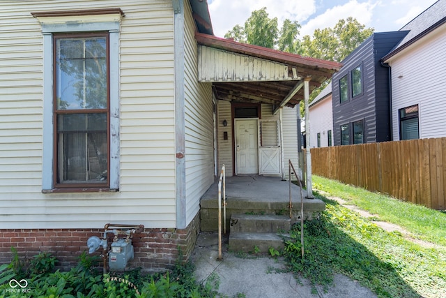 property entrance featuring fence