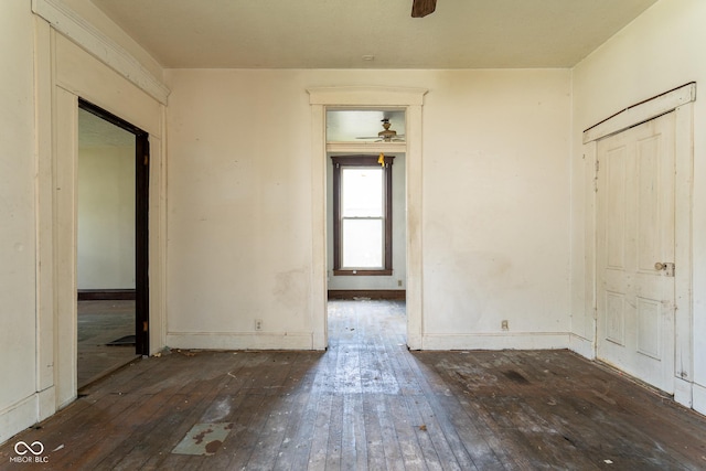 interior space featuring baseboards and hardwood / wood-style flooring