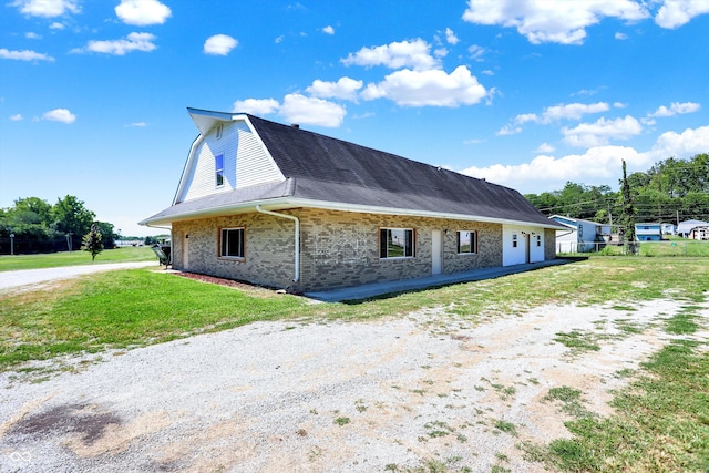 view of property exterior with a lawn