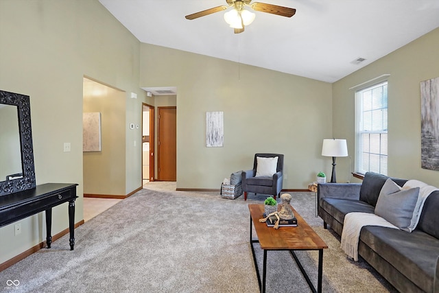 carpeted living room featuring lofted ceiling and ceiling fan