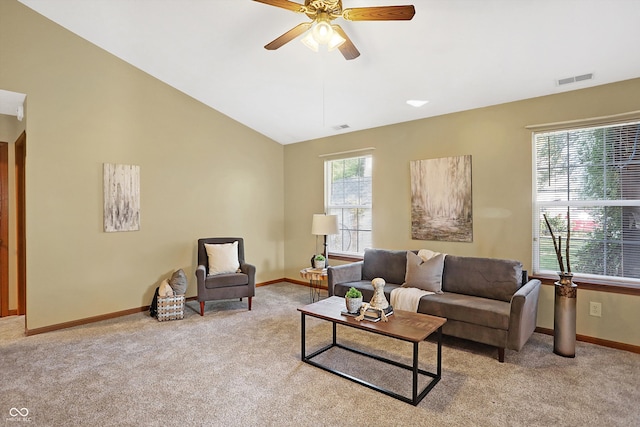 carpeted living room with lofted ceiling and ceiling fan