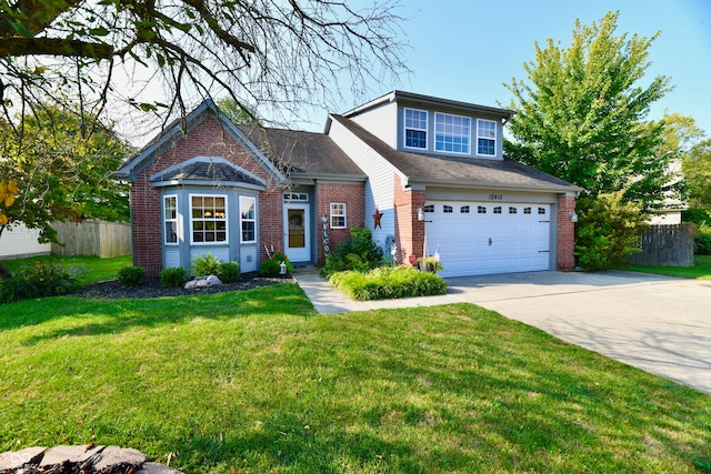 view of front of house featuring a garage and a front lawn