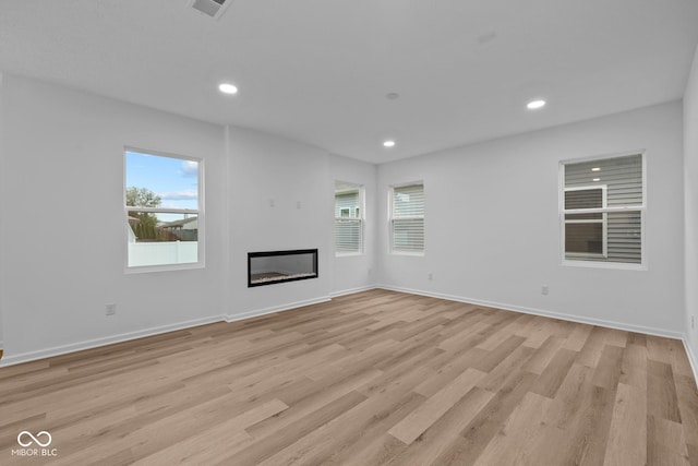 unfurnished living room featuring light wood-type flooring