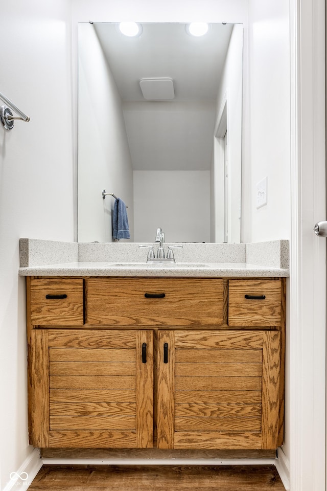 bathroom featuring vanity and baseboards