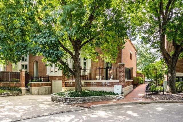 view of front of home featuring brick siding