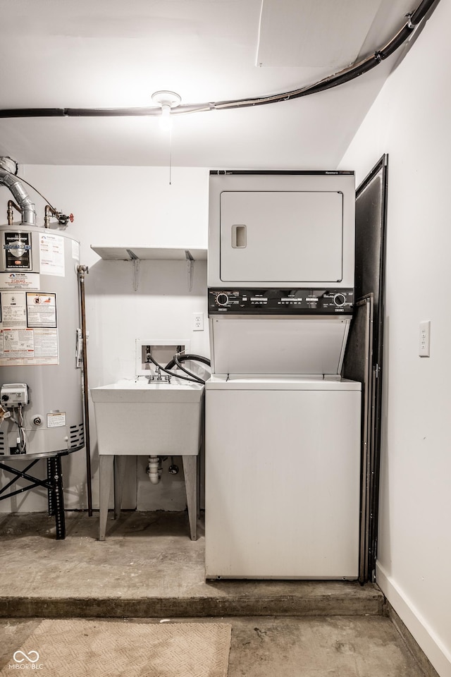 laundry room featuring baseboards, stacked washing maching and dryer, laundry area, a sink, and gas water heater