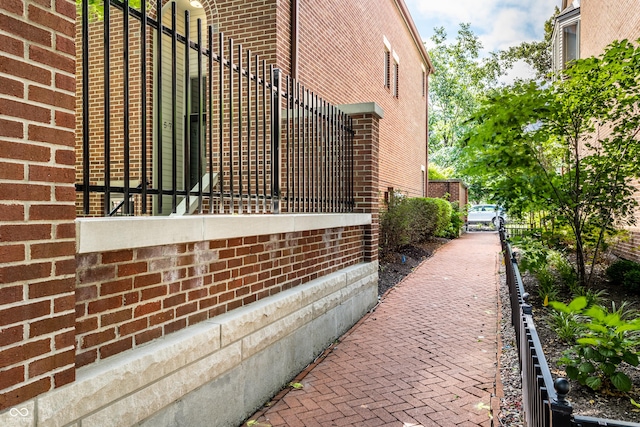 view of property exterior featuring brick siding