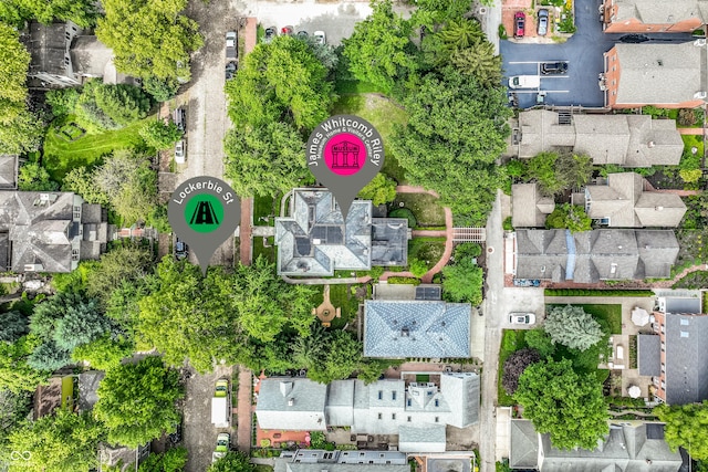 birds eye view of property with a residential view