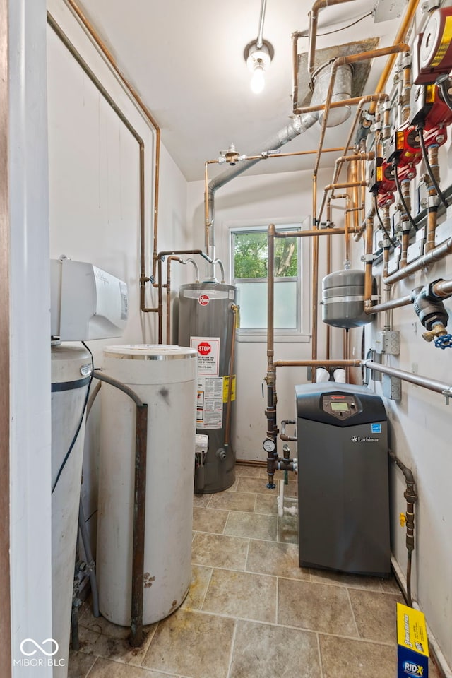 utility room featuring water heater