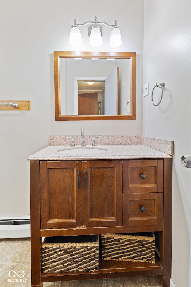 bathroom with vanity and a baseboard heating unit