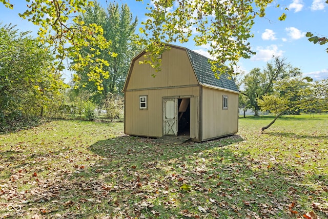 view of outdoor structure featuring a lawn