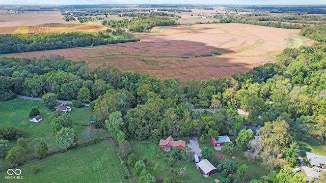 birds eye view of property with a rural view