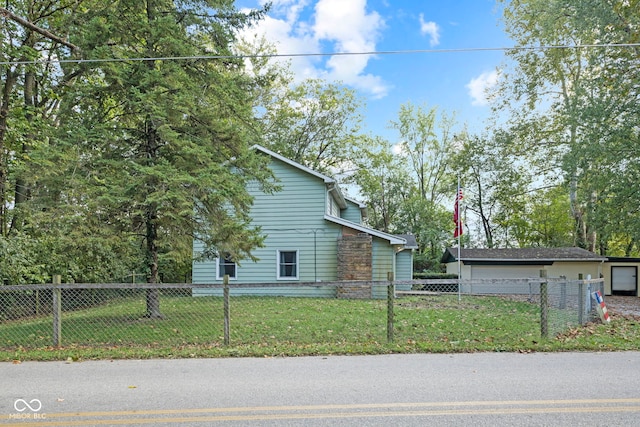 view of side of property with a lawn