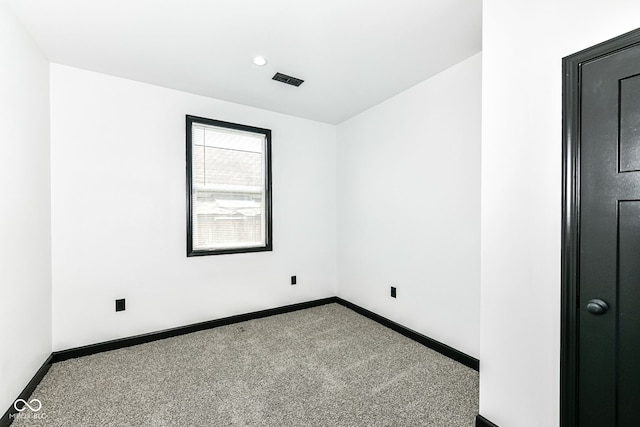 unfurnished room featuring recessed lighting, visible vents, baseboards, and carpet