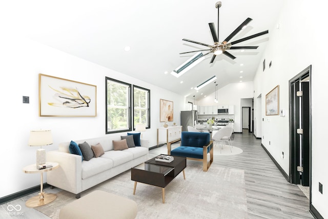 living room featuring high vaulted ceiling, light wood-style flooring, recessed lighting, a skylight, and baseboards