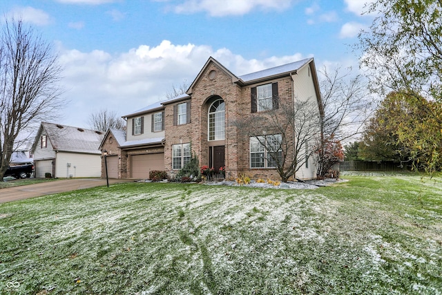 view of front facade featuring a garage and a front lawn