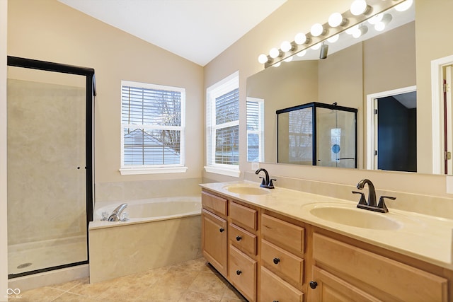 bathroom featuring tile patterned floors, vanity, plus walk in shower, and lofted ceiling