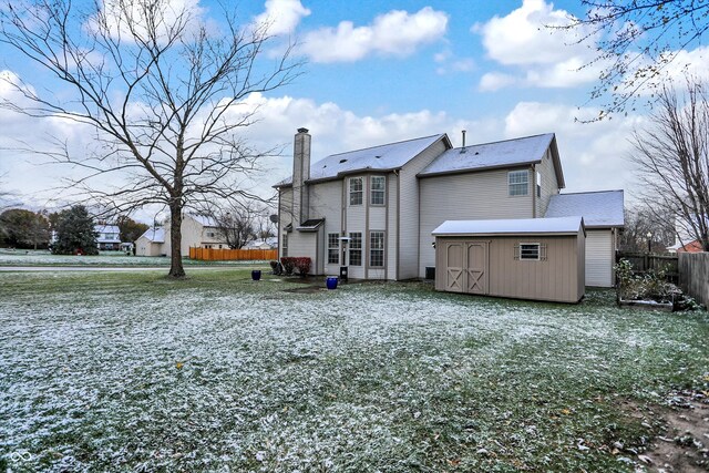 rear view of house with a shed