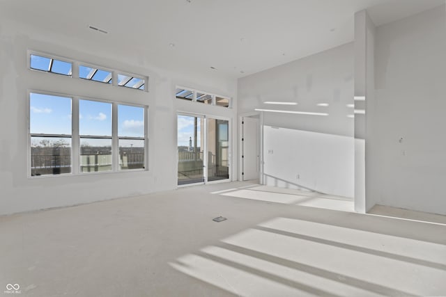 interior space with visible vents and a high ceiling