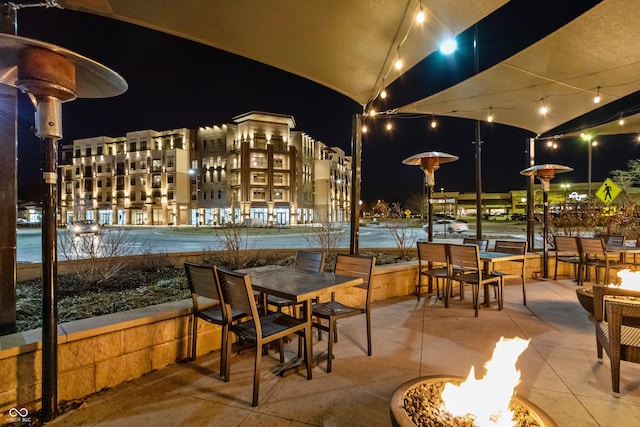 patio at twilight with outdoor dining space