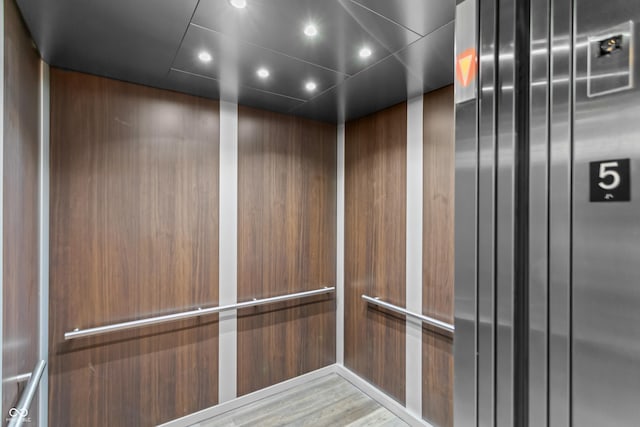 details with elevator and recessed lighting