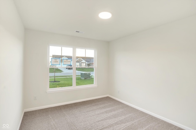 view of carpeted spare room