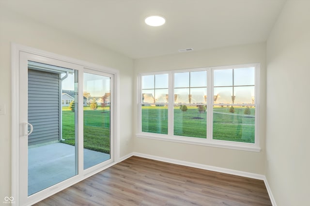 unfurnished sunroom with plenty of natural light