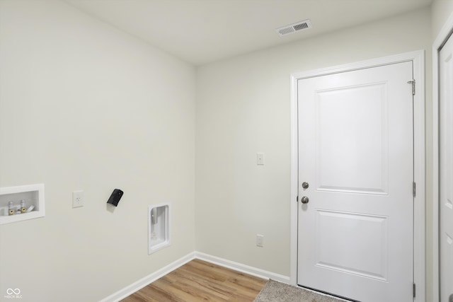 laundry area with hookup for a washing machine and hardwood / wood-style flooring