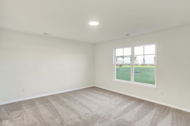 spare room with carpet floors